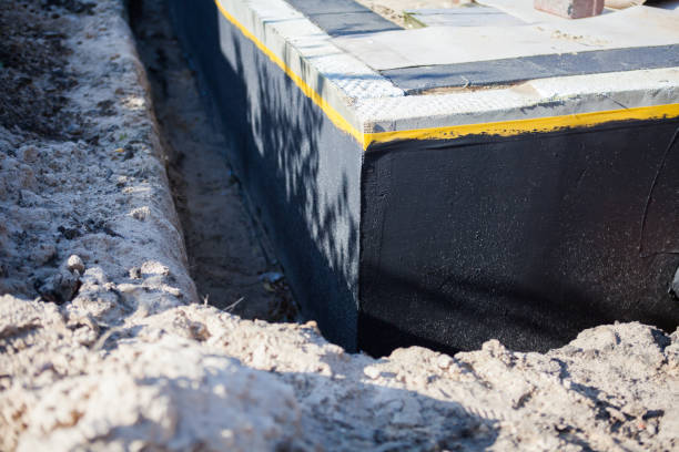 Professional Basement Waterproofing technician working in Hobart, WI